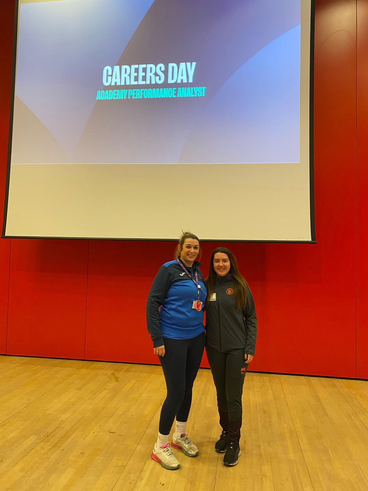 student and teacher presenting on career day