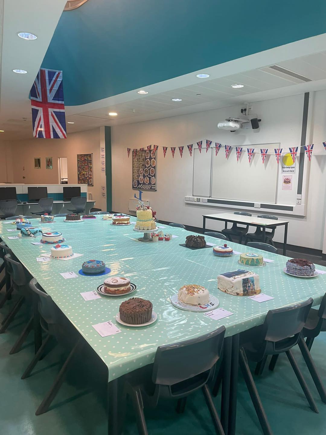 Bake off entry cakes laid out on a large table